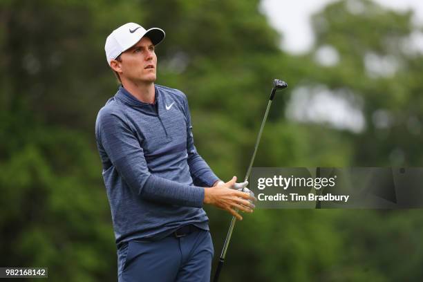 Russell Henley of the United States plays his shot from the fifth tee during the third round of the Travelers Championship at TPC River Highlands on...