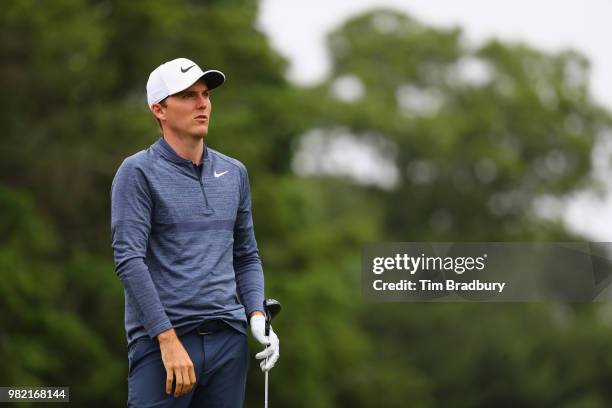 Russell Henley of the United States plays his shot from the fifth tee during the third round of the Travelers Championship at TPC River Highlands on...