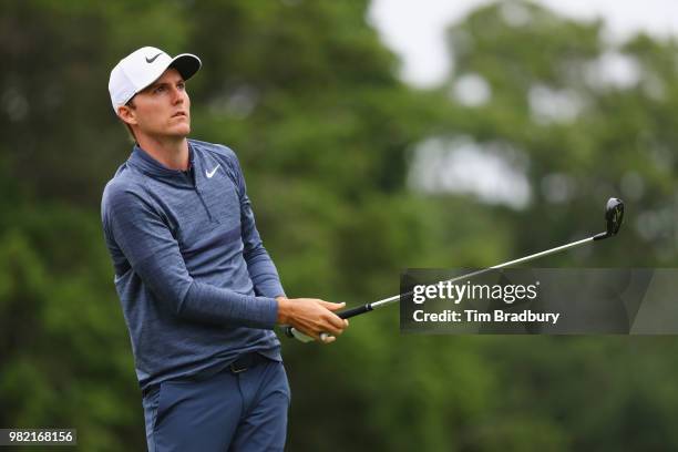 Russell Henley of the United States plays his shot from the fifth tee during the third round of the Travelers Championship at TPC River Highlands on...