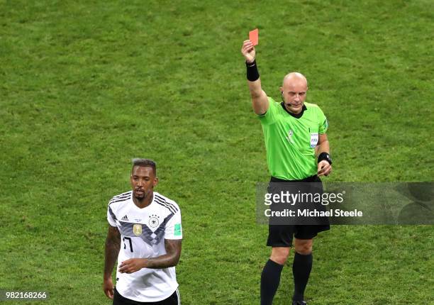 Jerome Boateng of Germany is shown a redcard by referee Szymon Marciniak during the 2018 FIFA World Cup Russia group F match between Germany and...