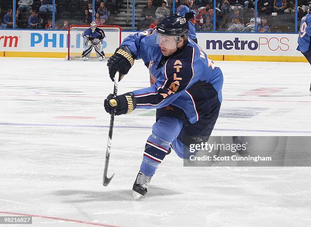 Todd White of the Atlanta Thrashers fires a shot against the Nashville Predators at Philips Arena on March 9, 2010 in Atlanta, Georgia.