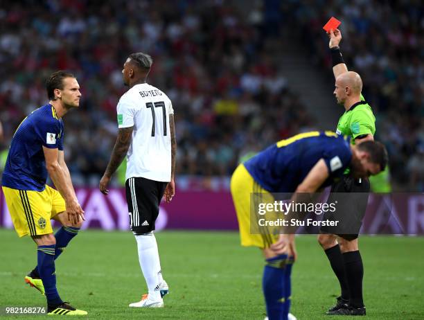 Jerome Boateng of Germany is shown a redcard by referee Szymon Marciniak during the 2018 FIFA World Cup Russia group F match between Germany and...