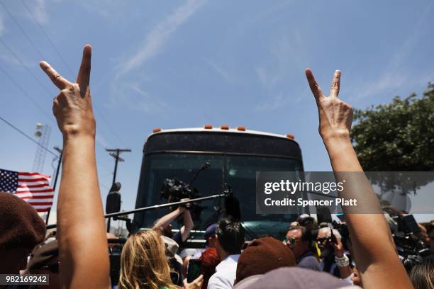 Protesters against the Trump administration's border policies try to block a bus carrying migrant children out of a U.S. Customs and Border...