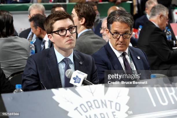 Kyle Dubas and Brendan Shanahan of the Toronto Maple Leafs handle the draft table during the 2018 NHL Draft at American Airlines Center on June 23,...