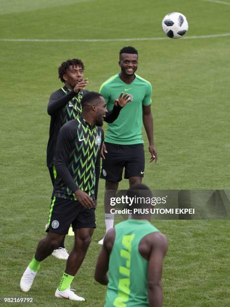 Nigeria's forward Alex Iwobi and Nigeria's defender Chidozie Awaziem take part in a training session at Essentuki Arena in southern Russia on June 23...