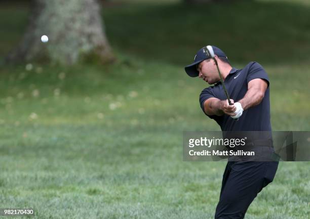 Jason Day of Australia hits his third shot on the third hole during the third round of the Travelers Championship at TPC River Highlands on June 23,...