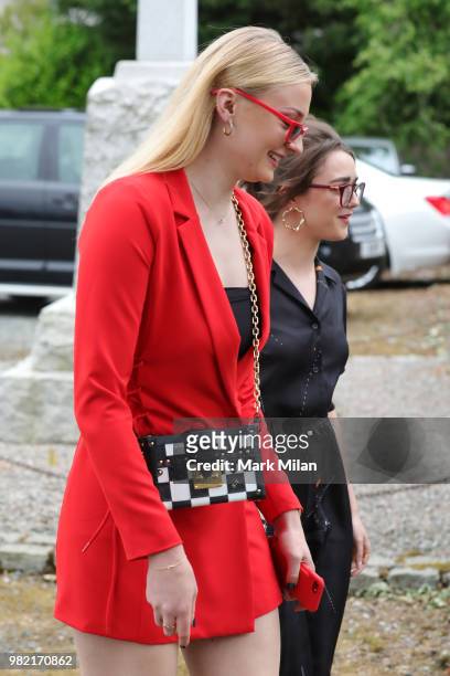 Sophie Turner and Maisie Williams arriving at Rayne Church in Kirkton on Rayne for the wedding of Kit Harrington and Rose Leslie on June 23, 2018 in...