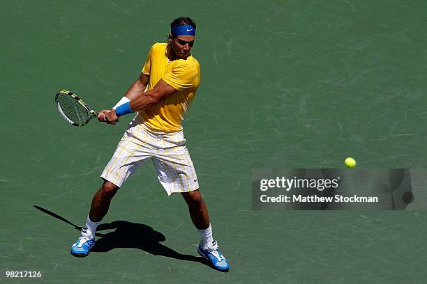 Rafael Nadal of Spain returns a shot against Andy Roddick of the United States during day eleven of the 2010 Sony Ericsson Open at Crandon Park...