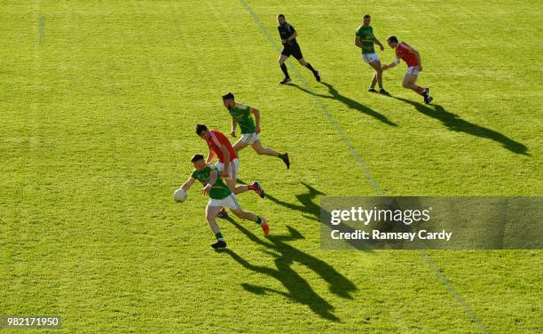 Carrick-on-Shannon , Ireland - 23 June 2018; Alan Armstrong of Leitrim in action against Tommy Durnin of Louth during the GAA Football All-Ireland...