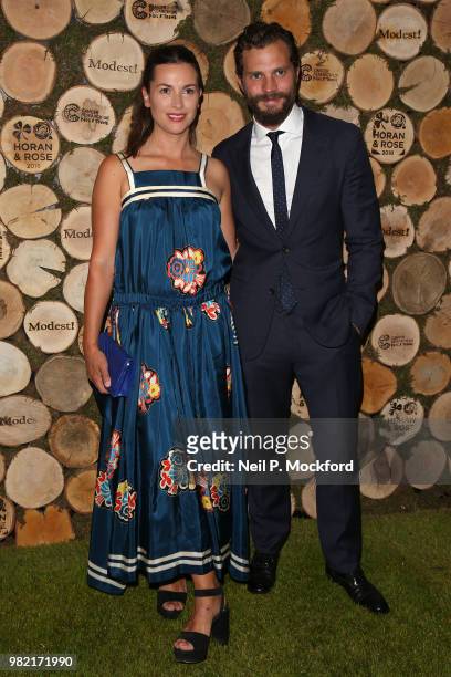 Amelia Warner and Jamie Dornan attend the Horan And Rose Charity Event held at The Grove on June 23, 2018 in Watford, England.