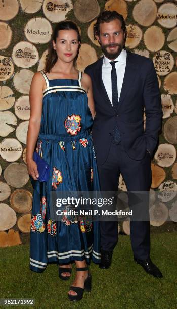 Amelia Warner and Jamie Dornan attend the Horan And Rose Charity Event held at The Grove on June 23, 2018 in Watford, England.