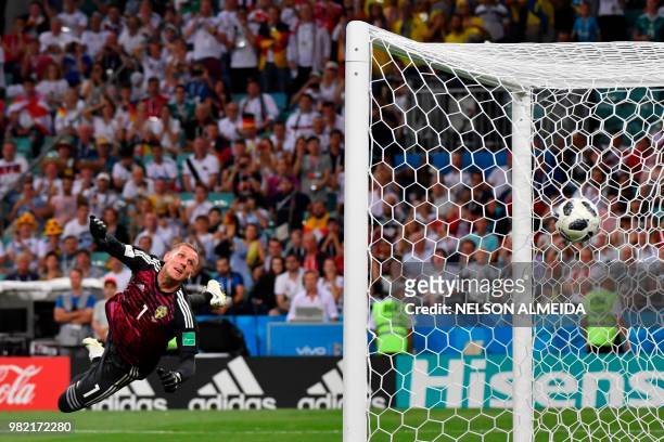Sweden's goalkeeper Robin Olsen watchs Germany's midfielder Toni Kroos' free kick go in during the Russia 2018 World Cup Group F football match...