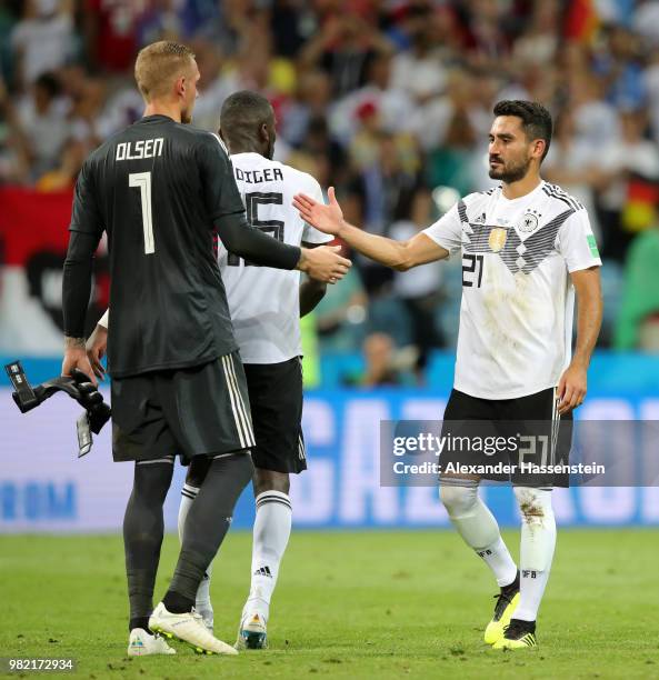 Robin Olsen of Sweden is consoled by Jerome Boateng and Ilkay Guendogan of Germany following the 2018 FIFA World Cup Russia group F match between...