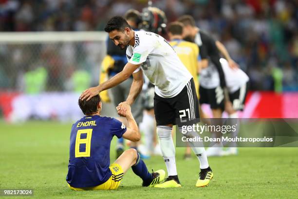 Albin Ekdal of Sweden is consoled by Ilkay Guendogan of Germany following the 2018 FIFA World Cup Russia group F match between Germany and Sweden at...