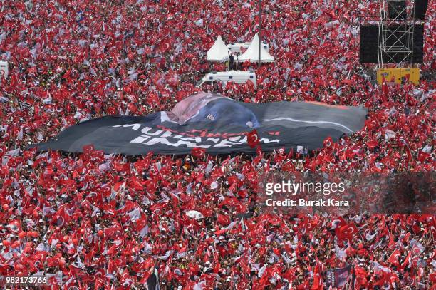 Thousands of supporters wave flags and cheer as they listen during an election rally for Muharrem Ince, presidential candidate of Turkey's main...