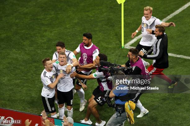 Toni Kroos of Germany celebrates with teammates after scoring his sides winning goal during the 2018 FIFA World Cup Russia group F match between...