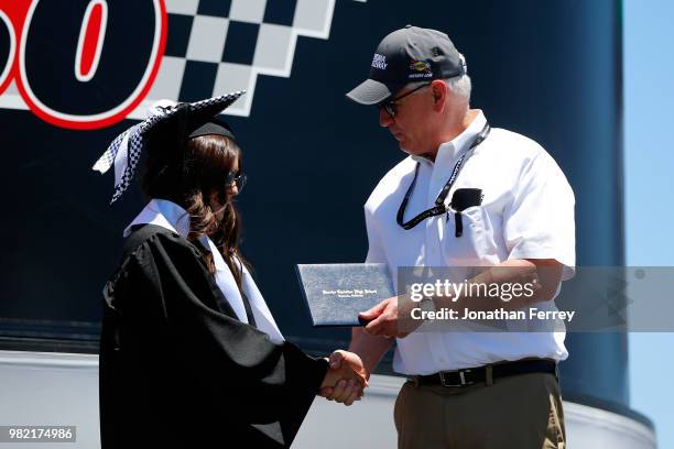 Hailie Deegan, driver of the Mobil 1/NAPA Power Premium Plus Toyota, receives her diploma on stage prior to the NASCAR K&N Pro Series West Carneros...