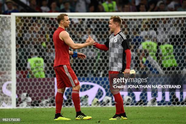 Germany's goalkeeper Manuel Neuer speaks to Germany's goalkeeper Marc-Andre Ter Stegen following the Russia 2018 World Cup Group F football match...