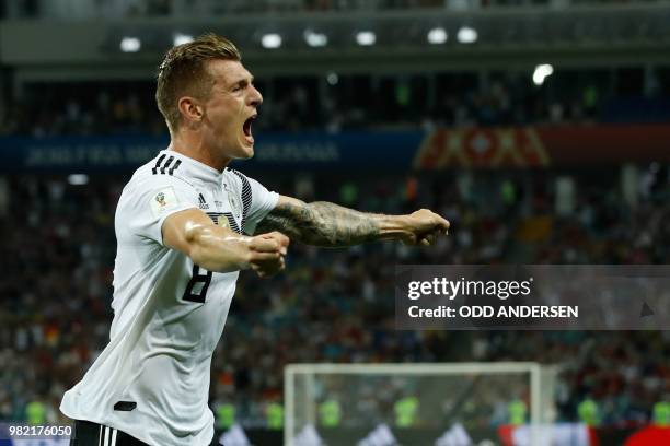 Germany's midfielder Toni Kroos celebrates after scoring a goal during the Russia 2018 World Cup Group F football match between Germany and Sweden at...