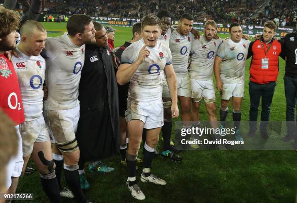 Owen Farrell, the England captain, issues instructions to his team after their victory during the third test match between South Africa and England...