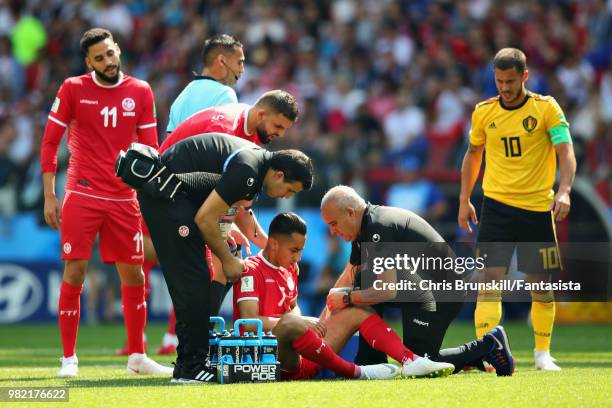 Saif Eddine Khaoui of Tunisia is checked over by a physio during the 2018 FIFA World Cup Russia group G match between Belgium and Tunisia at Spartak...