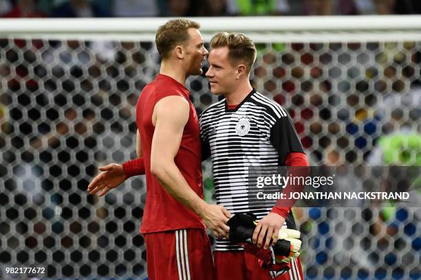 Germany's goalkeeper Manuel Neuer speaks to Germany's goalkeeper Marc-Andre Ter Stegen following the Russia 2018 World Cup Group F football match...