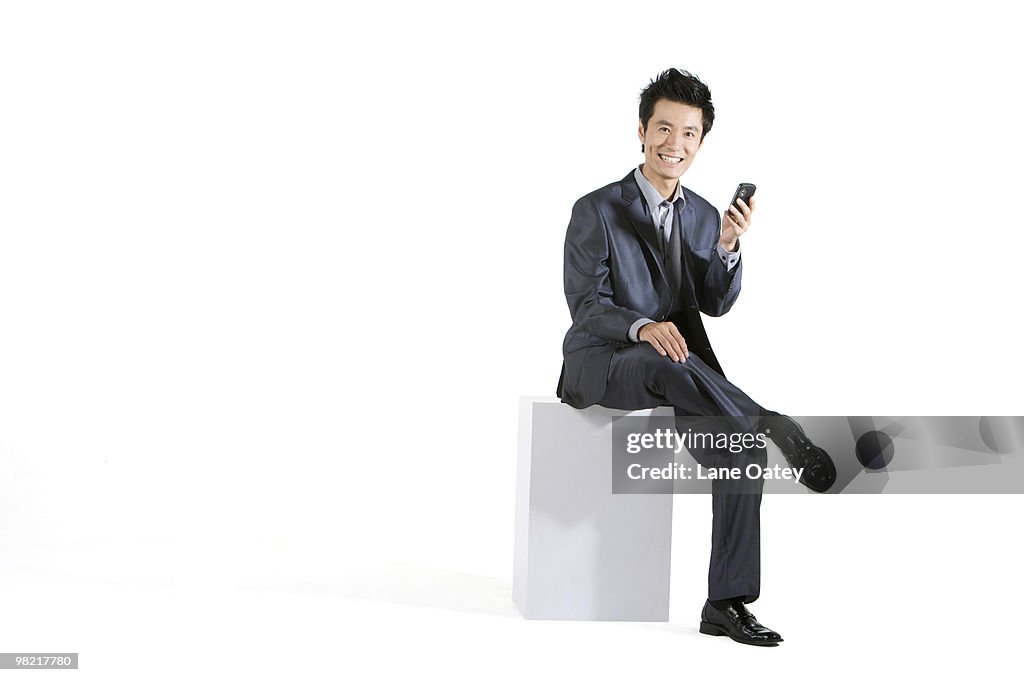 Businessman using cellphone