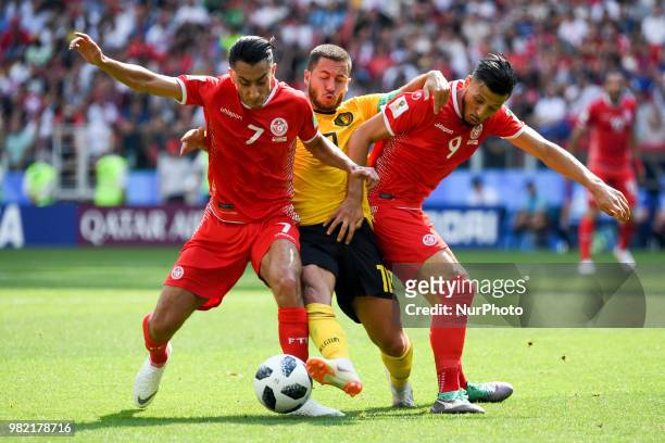Eden Hazard of Belgium fights for the ball with Saifeddine Khaoui and Anice Badri of Tunisia during the 2018 FIFA World Cup Group G match between...