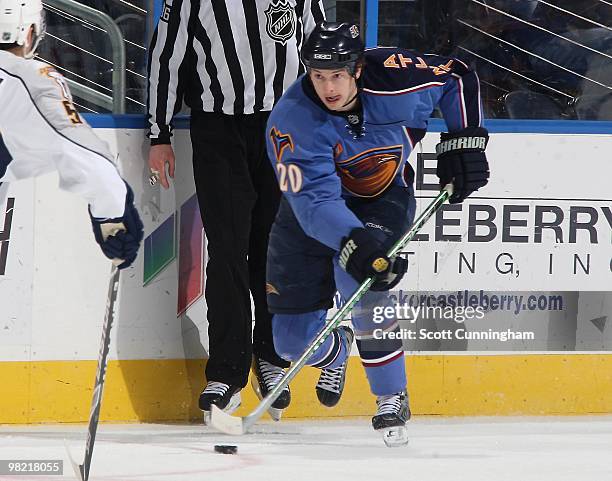 Colby Armstrong of the Atlanta Thrashers carries the puck against the Nashville Predators at Philips Arena on March 9, 2010 in Atlanta, Georgia.