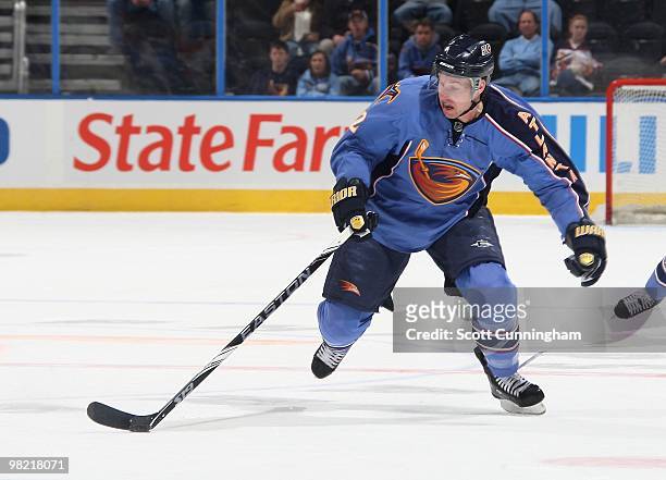 Todd White of the Atlanta Thrashers carries the puck against the Nashville Predators at Philips Arena on March 9, 2010 in Atlanta, Georgia.