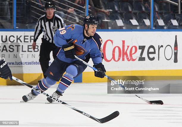 Marty Reasoner of the Atlanta Thrashers carries the puck against the Nashville Predators at Philips Arena on March 9, 2010 in Atlanta, Georgia.