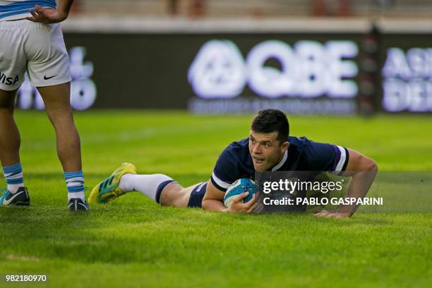 Blair Kinghorn from Scotland, scores a try during their international test match against Argentina, at the Centenario stadium, in Resistencia, Chaco...