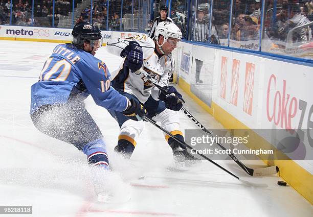 Bryan Little of the Atlanta Thrashers battles for the puck against Dan Hamhuis of the Nashville Predators at Philips Arena on March 9, 2010 in...