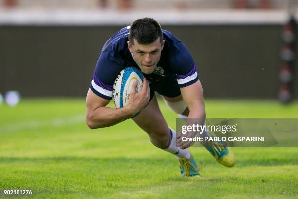 Blair Kinghorn from Scotland, dives to score a try during their international test match against Argentina, at the Centenario stadium, in...