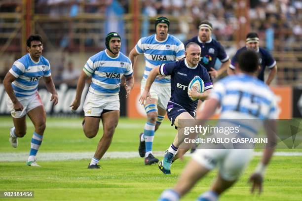 Nick Grigg from Scotland runs with the ball, during their international test match against Argentina, at the Centenario stadium, in Resistencia,...