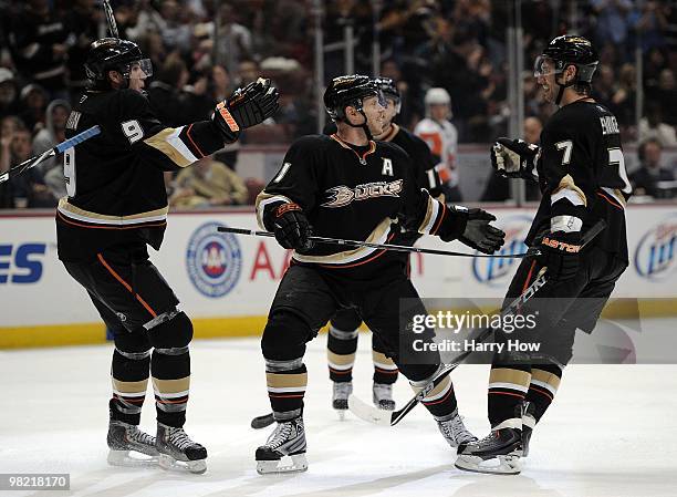 Saku Koivu, Steve Eminger and Bobby Ryan of the Anaheim Ducks celebrate a game tying goal against the New York Islanders at the Honda Center on March...