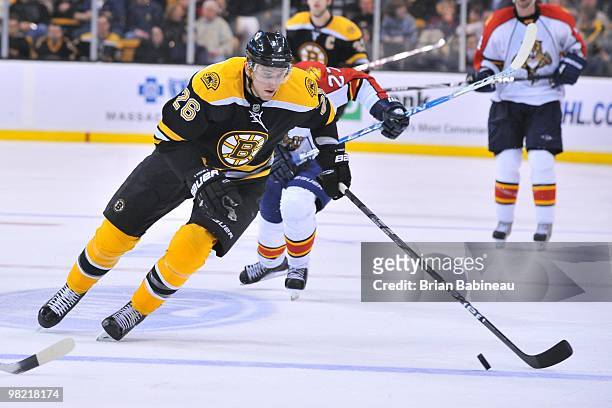 Blake Wheeler of the Boston Bruins skates up the ice with the puck against the Florida Panthers at the TD Garden on April 1, 2010 in Boston,...