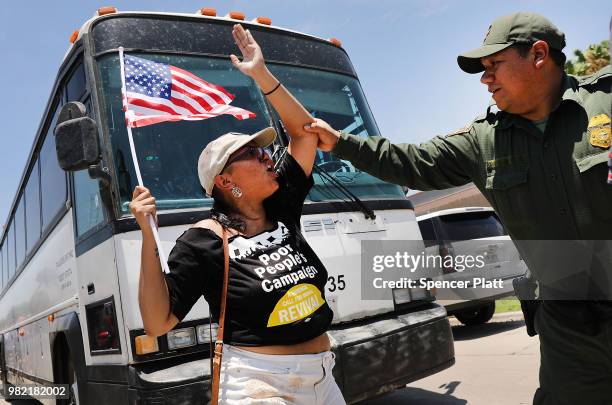 Protesters against the Trump administration's border policies try to block a bus carrying migrant children out of a U.S. Customs and Border...