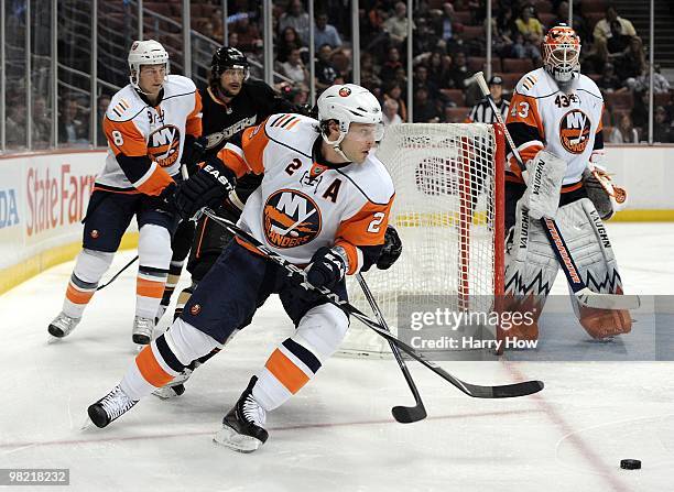 Mark Streit of the New York Islanders clears his zone against the Anaheim Ducks at the Honda Center on March 19, 2010 in Anaheim, California.