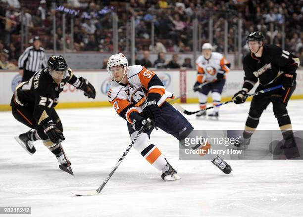 Blake Comeau of the New York Islanders breaks in around Scott Niedermayer and Corey Perry of the Anaheim Ducks at the Honda Center on March 19, 2010...