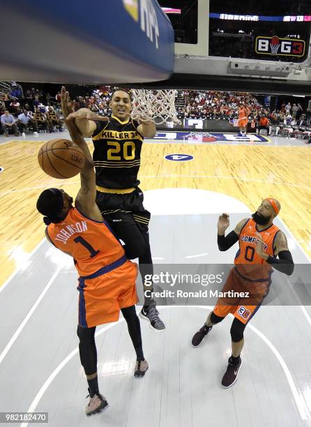 DerMarr Johnson of 3's Company blocks the shot of Ryan Hollins of Killer 3s during week one of the BIG3 three on three basketball league at Toyota...