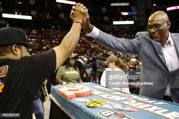 League Co-Founder, Ice Cube, presents Commissioner, Clyde Drexler, with a birthday cake during week one of the BIG3 three on three basketball league...