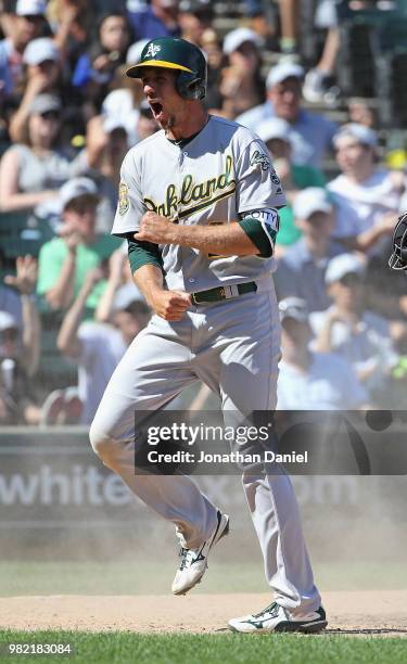 Stephen Piscotty of the Oakland Athletics celebrates after scoring a run in the t8h inning against the Chicago White Sox at Guaranteed Rate Field on...