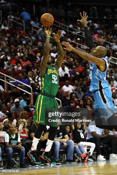 DeShawn Stevenson of Ball Hogs shoots in front of the defense of Corey Maggette of Power during week one of the BIG3 three on three basketball league...