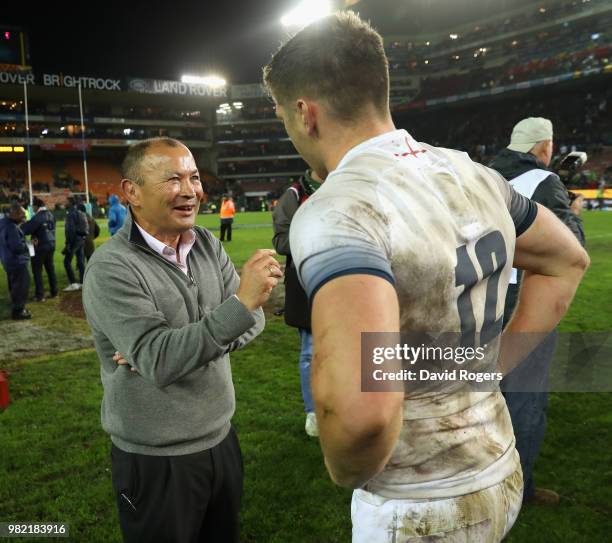 Eddie Jones, the England head coach celebrates wtih his captain Owen Farrell after their victory during the third test match between South Africa and...