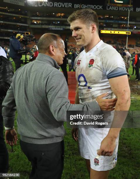 Eddie Jones, the England head coach celebrates wtih his captain Owen Farrell after their victory during the third test match between South Africa and...