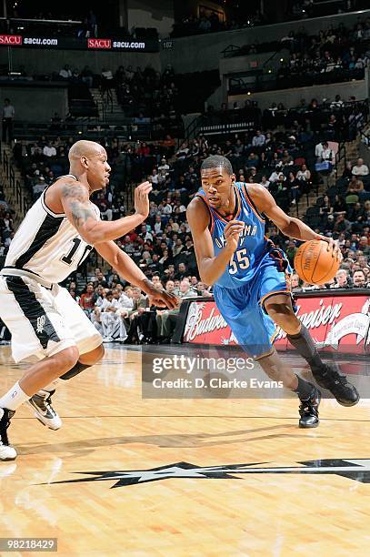 Kevin Durant of the Oklahoma City Thunder moves the ball against Keith Bogans of the San Antonio Spurs during the game on February 24, 2010 at the...