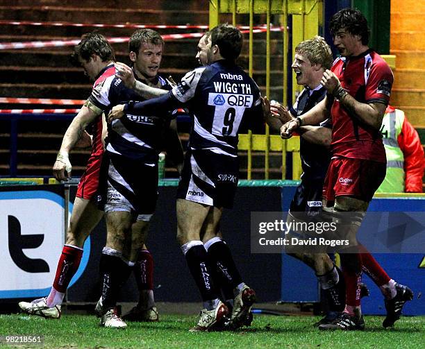 Mark Cueto of Sale is congratulated by team mates after scoring a try during the Guinness Premiership match between Sale Sharks and Worcester...