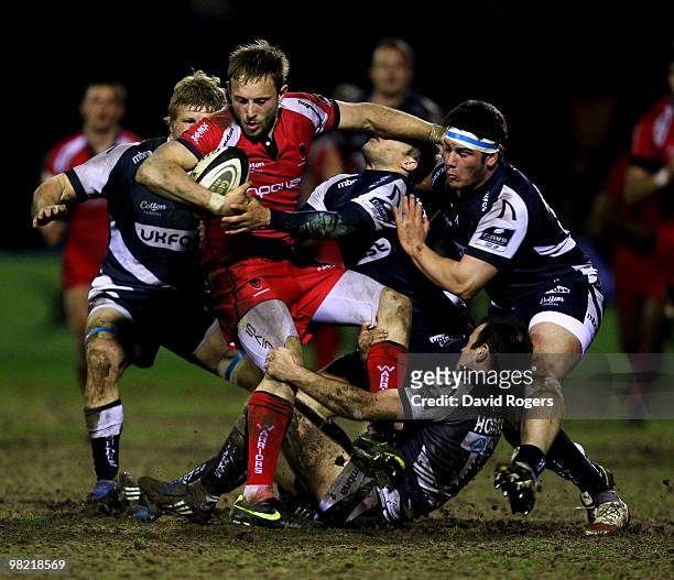 Chris Pennell of Worcester is tackled by the Sale defence during the Guinness Premiership match between Sale Sharks and Worcester Warriors at Edgeley...