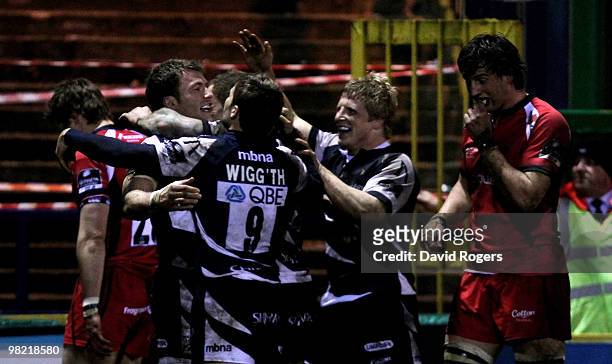 Mark Cueto of Sale is congratulated by team mates after scoring a try during the Guinness Premiership match between Sale Sharks and Worcester...